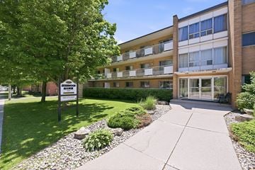 Hamilton apartment for rent - A building with a sign that says "Sale" in front of it.