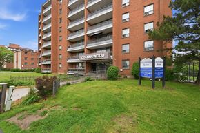 Stoney Creek apartment for rent - Collingwood apartment building with a sign in front.