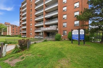 Stoney Creek apartment for rent - Collingwood apartment building with a sign in front.