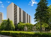Hamilton apartment for rent - A modern building with a green lawn in front.
