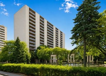 Hamilton apartment for rent - A modern building with a green lawn in front.