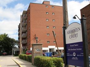 Hamilton apartment for rent - A sign for Aberdeen Court is in front of a brick building.