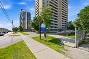 Hamilton apartment for rent - A street view with a sign that says "Bellmore".