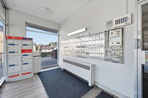 Hamilton apartment for rent - A row of mailboxes are lined up on a wall.