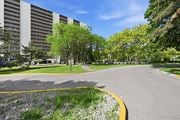Hamilton apartment for rent - A road with a yellow line on the side and a building in the background.