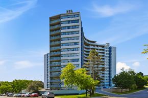 Hamilton apartment for rent - A tall building with a blue sky in the background.
