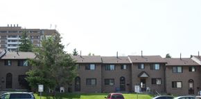 Hamilton apartment for rent - Apartment complex with a parking lot in front.