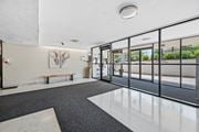 Hamilton apartment for rent - A hallway with a bench and a painting of an elephant on the wall.