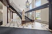 Hamilton apartment for rent - A marble statue stands on a staircase with a black railing.