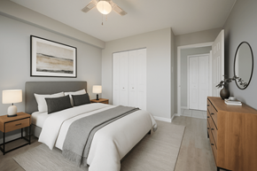 Hamilton apartment for rent - A bedroom with a large bed, a painting above it, and a wooden dresser.