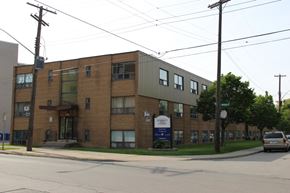 Hamilton apartment for rent - A building with a sign that says "Habitat for Humanity" on it.