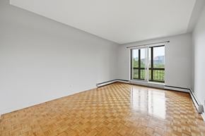 Hamilton apartment for rent - A room with a wooden floor and a sliding glass door.