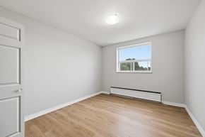 Hamilton apartment for rent - A room with a window and a radiator on the floor.