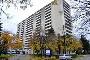 Hamilton apartment for rent - A tall building with a sign in front of it.