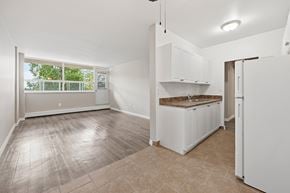 Hamilton apartment for rent - A kitchen with white cabinets and a countertop is shown.