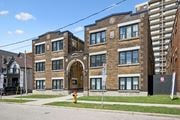 Kitchener apartment for rent - A building with a red fire hydrant in front of it.