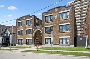 Kitchener apartment for rent - A building with a red fire hydrant in front of it.