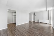 Hamilton apartment for rent - A room with wooden flooring and white walls.