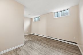 Hamilton apartment for rent - A room with a window and a wooden floor.