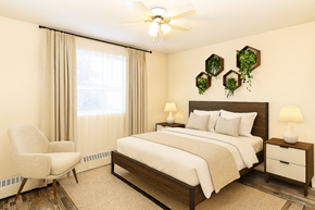 Hamilton apartment for rent - A bedroom with a bed, chair, and two lamps.