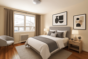 Hamilton apartment for rent - A bedroom with a large bed, a chair, and two framed pictures on the wall.
