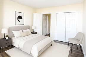 St. Catharines apartment for rent - A bedroom with a bed, chair, and a wall art.