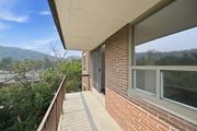 Hamilton apartment for rent - A balcony with a view of a mountain range.