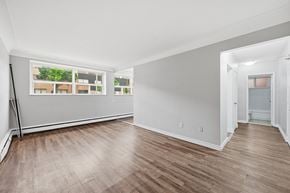 Hamilton apartment for rent - A room with wooden flooring and white walls.