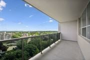 Kitchener apartment for rent - A balcony with a view of the cityscape and trees.