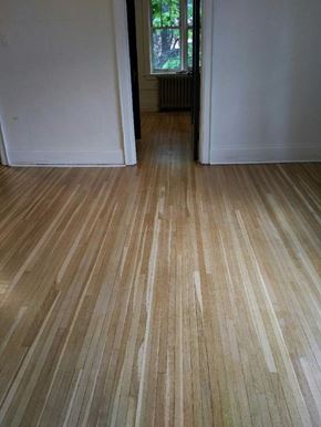 Kitchener apartment for rent - A room with a wooden floor and white walls.