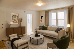 Kitchener apartment for rent - A living room with a white sofa, a green armchair, and a wooden coffee table.