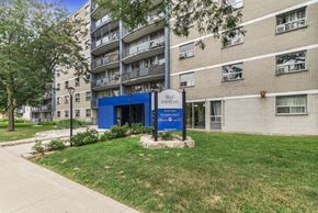 Hamilton apartment for rent - A blue sign in front of a building that says "Belle Fountain".
