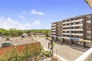 Dundas apartment for rent - A view of a street with a building on the right and a sign that says "KINGS CROSS".