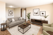 Stoney Creek apartment for rent - A living room with a grey couch, a coffee table, a side table, a chair, a potted plant, and pictures on the wall.