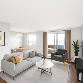 Hamilton apartment for rent - A living room with a grey couch, a grey armchair, a white coffee table, and a large window with curtains.