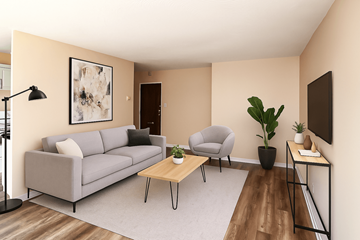 Stoney Creek apartment for rent - A living room with a grey couch, a grey armchair, a wooden coffee table, and a painting on the wall.