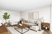 Stoney Creek apartment for rent - A living room with a white couch, a coffee table, and a plant.