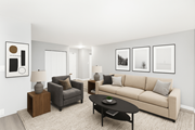 Hamilton apartment for rent - A living room with a couch, armchair, and coffee table.