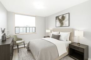 Hamilton apartment for rent - A bedroom with a large bed, a chair, and a window.