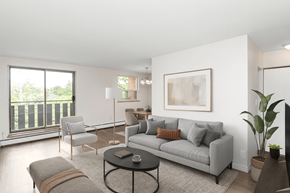 Hamilton apartment for rent - A living room with a grey couch, a coffee table, and a large window.