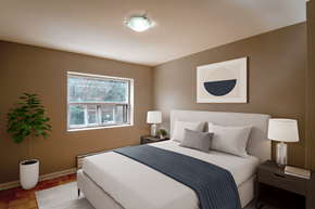 Stoney Creek apartment for rent - A bedroom with a large bed and a painting on the wall.