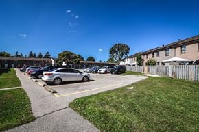 Kitchener apartment for rent - A parking lot with cars parked in it.