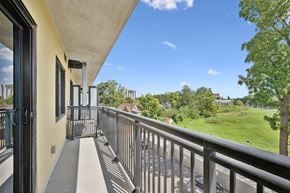 Kitchener apartment for rent - Balcony view overlooking green space and trees at The Maverick Apartments, Kitchener, ON