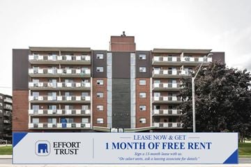 Hamilton apartment for rent - A large building with a sign in front that says "Effort Trust 1 Month of Free Rent".