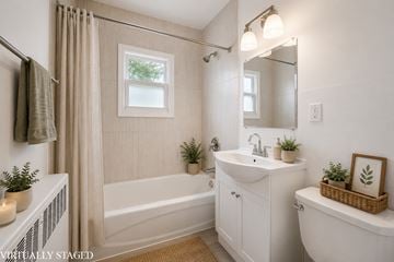 Kitchener apartment for rent - A bathroom with a white tub, sink, and toilet.