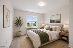 Kitchener apartment for rent - A bedroom with a large bed and a window.