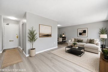 Hamilton apartment for rent - A living room with a couch, coffee table, and pictures on the wall.