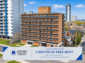 Hamilton apartment for rent - A large building with a sign offering a free month of rent.