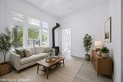 Kitchener apartment for rent - A living room with a white couch and a wooden coffee table.