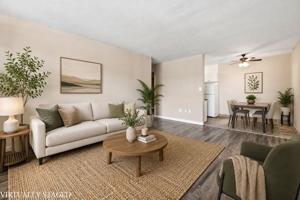 Hamilton apartment for rent - A living room with a white couch, a wooden coffee table, and a painting on the wall.